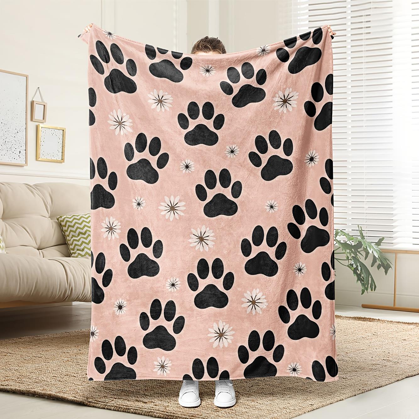 

This black and pink claw print blanket is machine washable made of polyester and suitable for bedroom and living room décor 75x100cm