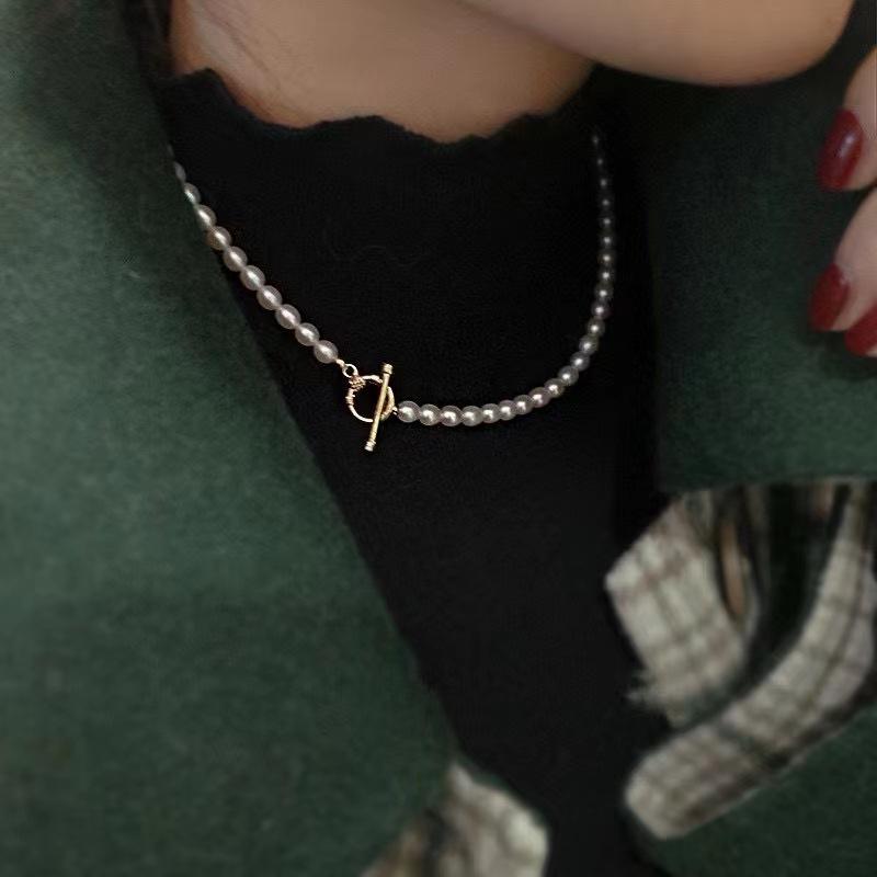 Freshwater pearl millet shaped necklace light luxury simple OT buckle collarbone chain pearl sweater chain strong light millet bead accessories
