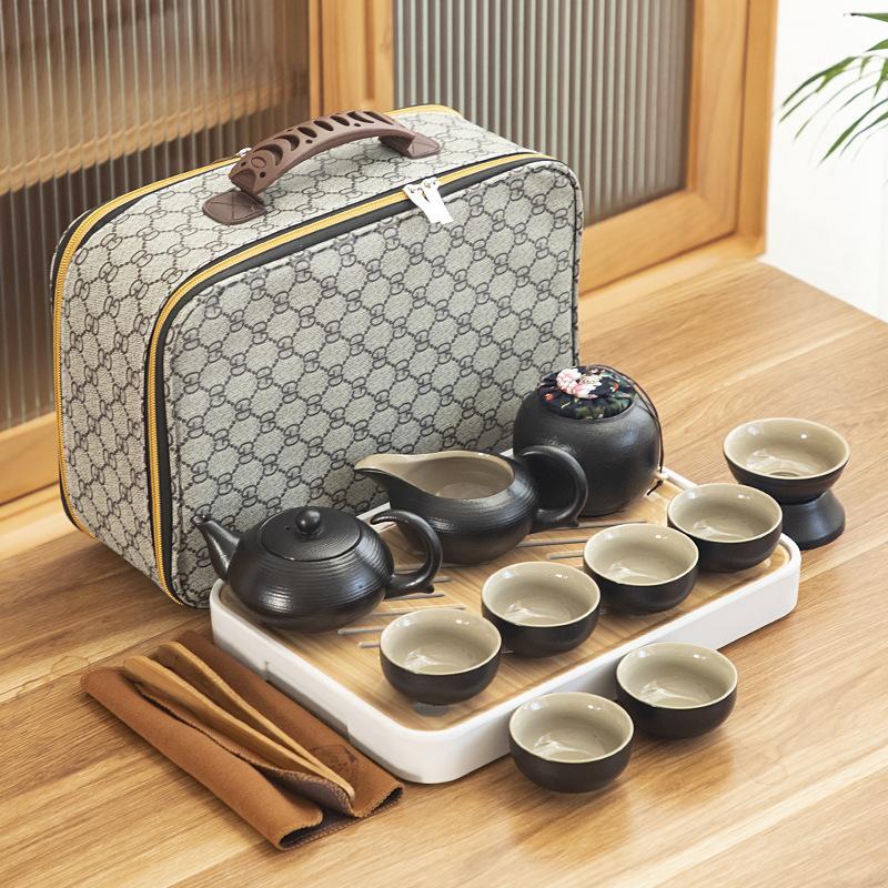 Black pottery travel kung fu tea set portable business gift set creative ceramic cooling pot set