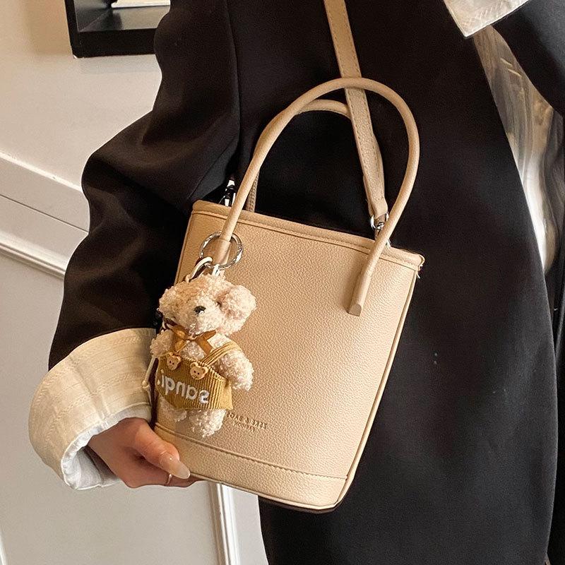 Wholesale New Products Niche Simple Solid Color Lychee Pattern Texture Hand Carry Bucket Bag Versatile Foreign Style Commuting Messenger Women's Bag