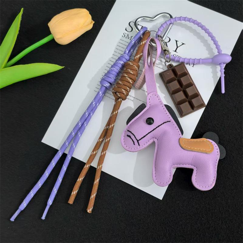 

1 шт. Кожаный брелок-пони, плетеный шнурок, подвеска для рюкзака, аксессуары для подвешивания на сумку для телефона, DIY украшение фиолетовый
