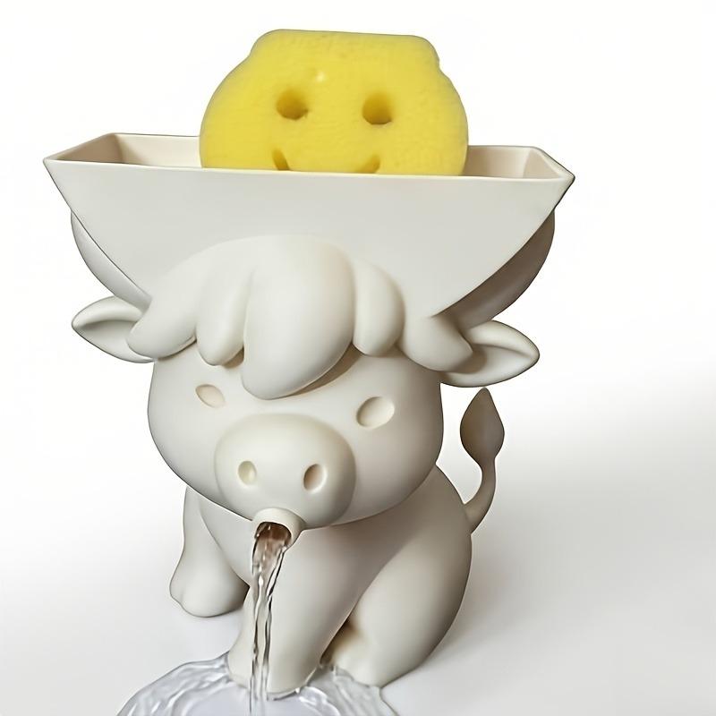 Cow-shaped sponge holder drains water via mouth. Cute sink organizer for kitchen & bathroom; sponge excluded.