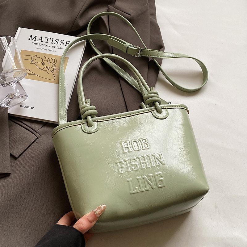 2025 popular new niche simple wind hand carrying bucket bag Korean version casual versatile commuter fashion messenger bag women