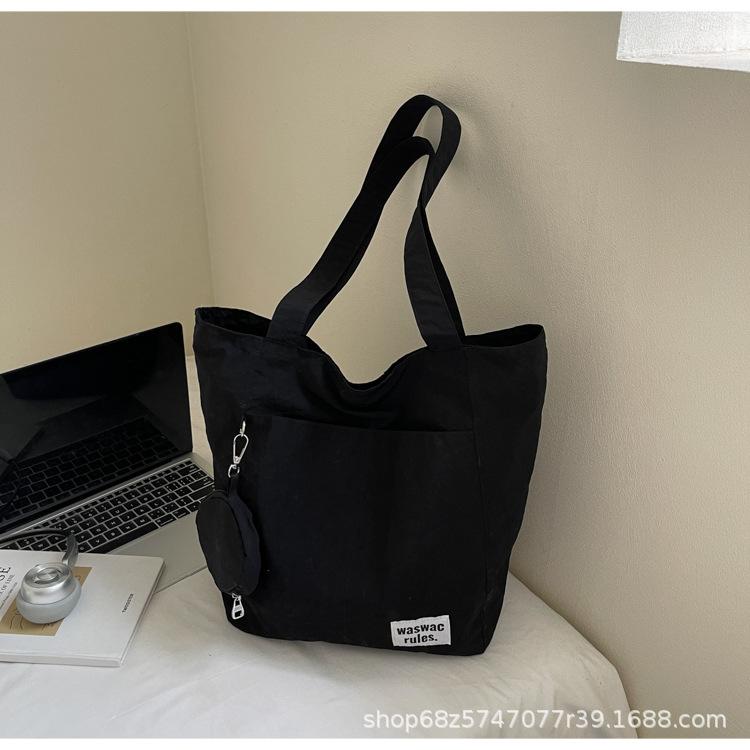 Japanese new waterproof nylon casual spring and summer shoulder bag women's design sense large-capacity commuter tote bag