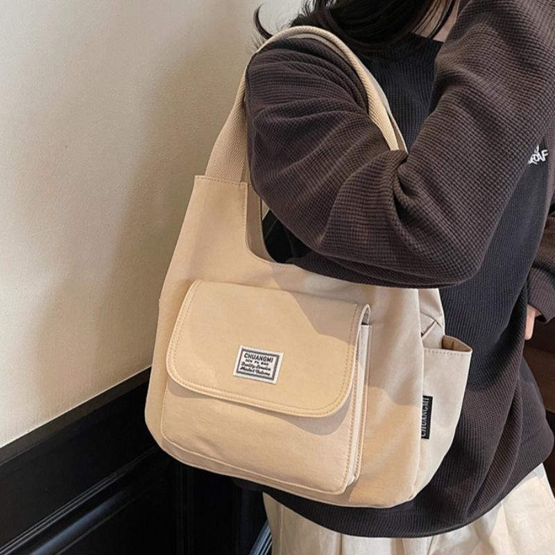 Neue japanische minimalistische Canvas-Einfache Tragetasche Damen Modisch und Vielseitig Kleine Umhängetasche Lässiges Design Pendeltasche