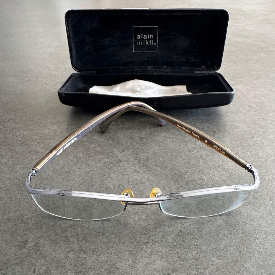 Used alain mikli glasses frame silver with case