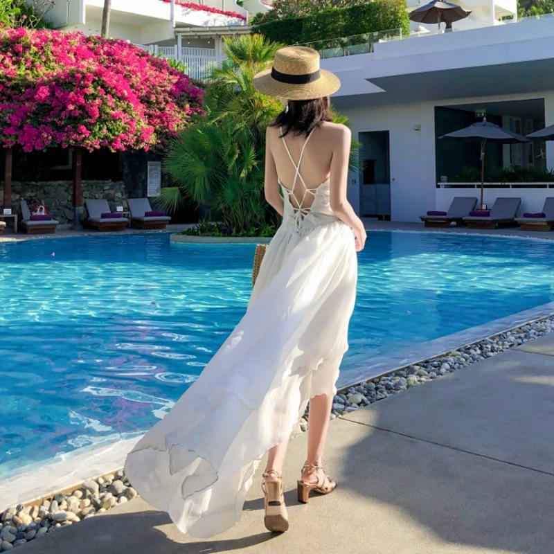 The real shot is very fairy beach dress, white niche suspender backless dress, women's summer seaside vacation ins super hot