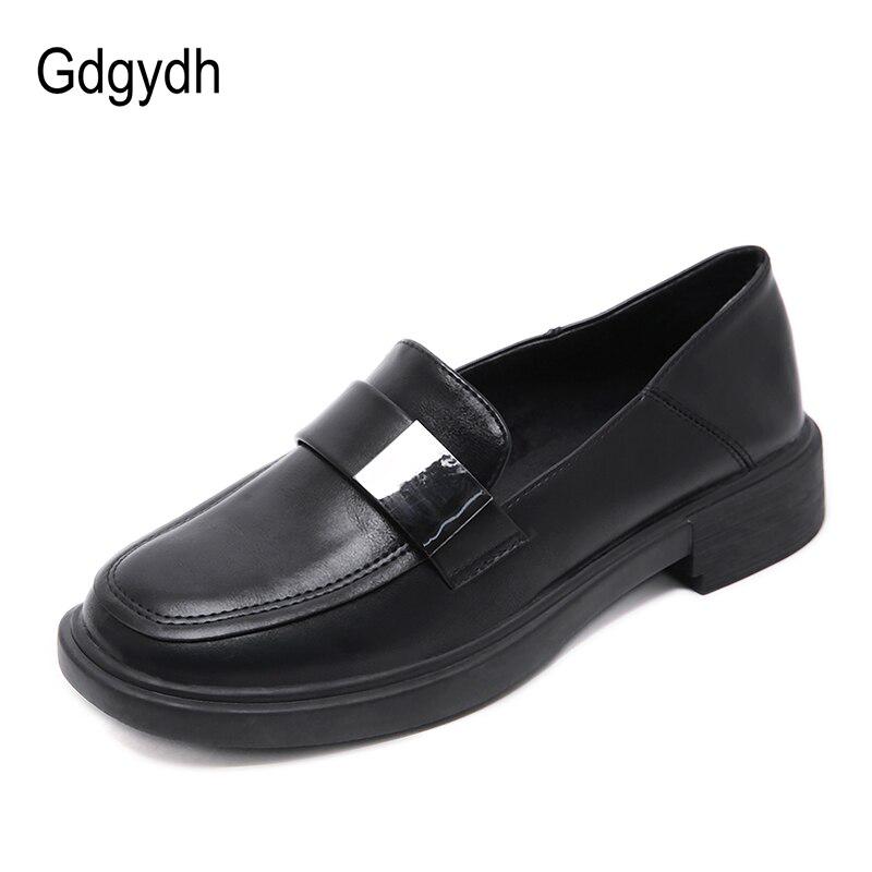 black loafers with brown sole