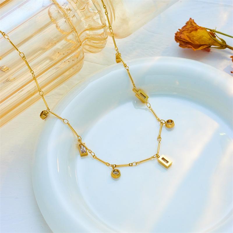 Luxury Gold-Tone Titanium Steel Necklace with Baguette-Cut Clear Crystals & Round Rhinestones – Elegant Dangle Chain Design