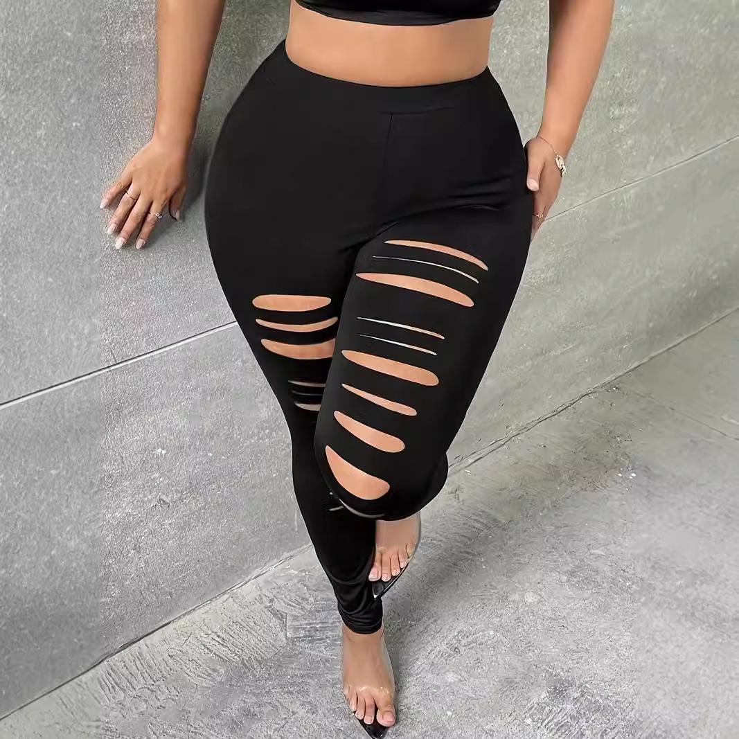 

Женские брюки однотонные с рваными низами и вырезами большого размера 4XL чёрный