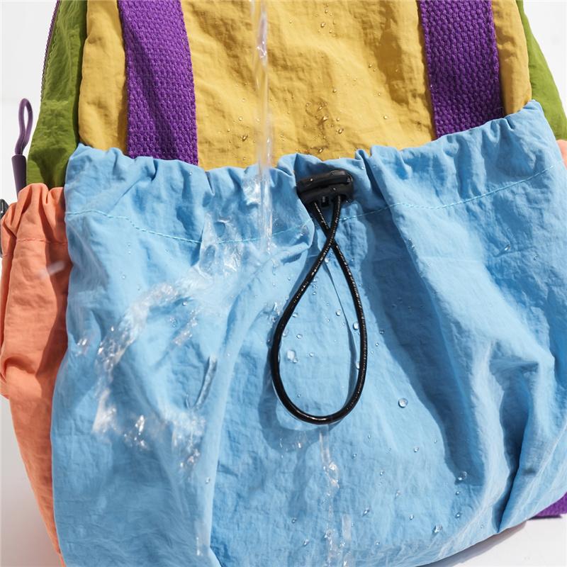 Color Block Backpack with Front Drawstring Pocket and Dual Carrying Options