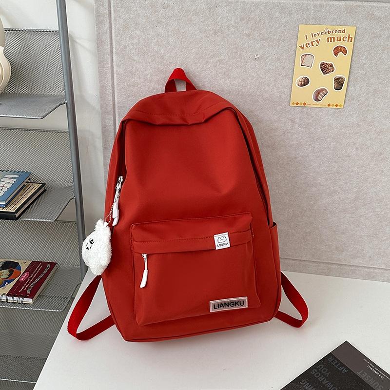 

Маленький свежий однотонный школьный рюкзак женский для учениц средней школы и студенток колледжа, простой рюкзак большой вместимости, повседневный рюкзак для мальчиков single package + pendant красный