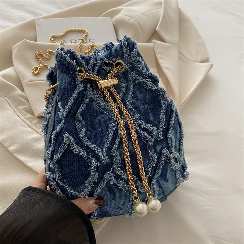 Niche design bucket bag spring and summer new drawstring burr women's bag messenger bag fashionable and simple shoulder bag