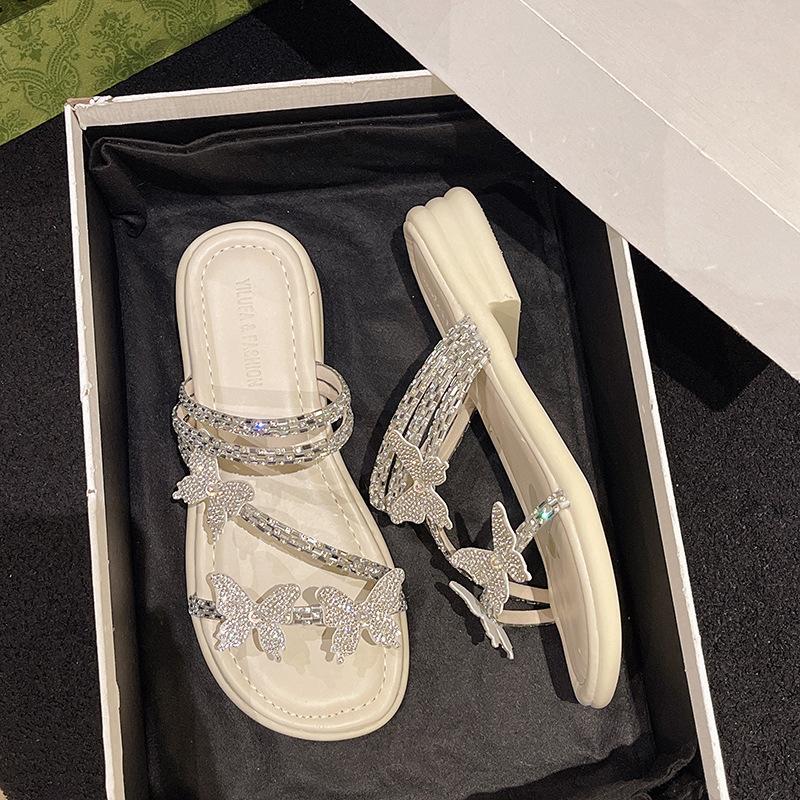 

Красивые крутые тапочки для улицы женские лето 2025 новые бабочка стразы с юбкой обувь сандалии тренд 40