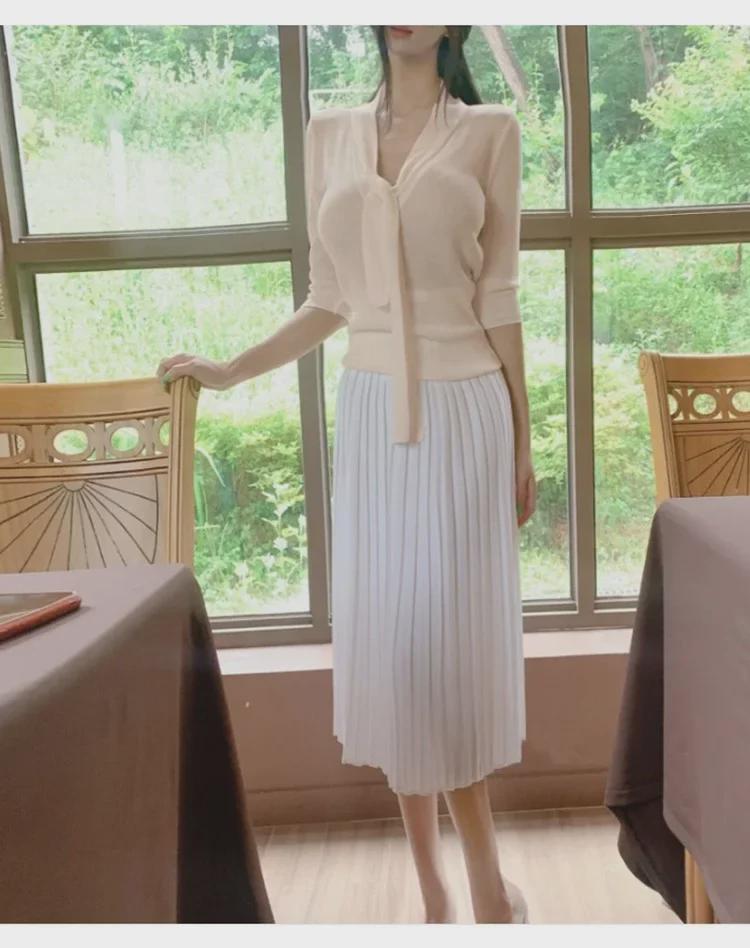 Koreanischer Dongdaemun Slim Fit Strickpullover mit halblangen Ärmeln und Schleifendesign für Damen