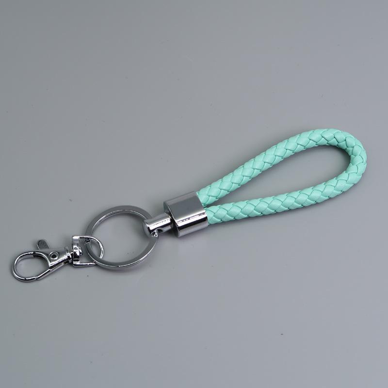 

Набір плетених вручну шкіряних брелоків з карабіном-собачкою, карабіном-ворітцями, брелоком та аксесуарами для тримача карток світло-синій колір