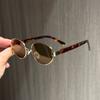 European and American retro-style, vintage-inspired metal oval sunglasses for women, offering sun protection and a sophisticated, Hong Kong-style
