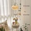 Elegant Cream Floor Lamp with Table and Storage - Perfect for Bedroom or Living Room Décor.