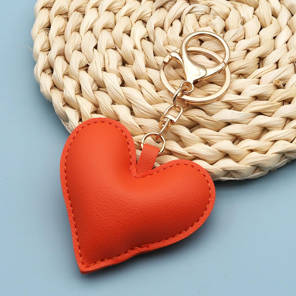 Spot wholesale PU simple peach heart bag pendant Xiaohongshu explosive love couple pendant keychain bag lanyard