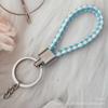 Gevlochten Lederen Touw Sleutelhanger met Poppenhanger - Modieus en Creatief Accessoire