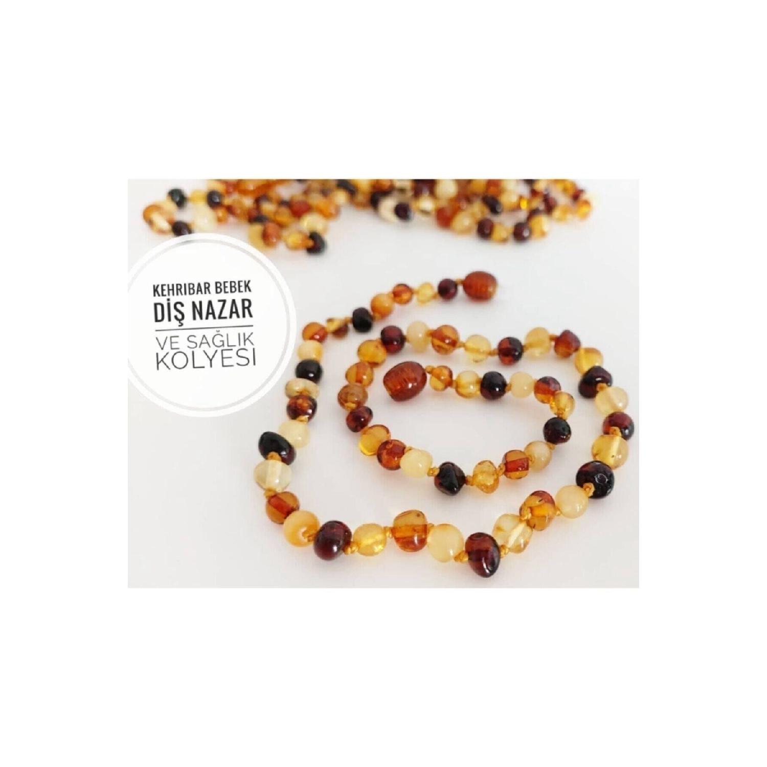 

Оригинальное янтарное ожерелье с детским зубом от сглаза и здоровья