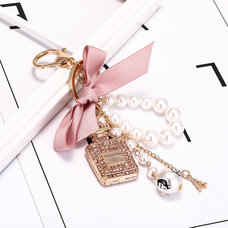 Korean-Style Handmade Rhinestone Perfume Bottle Keychain with Bow and Pearl Charm