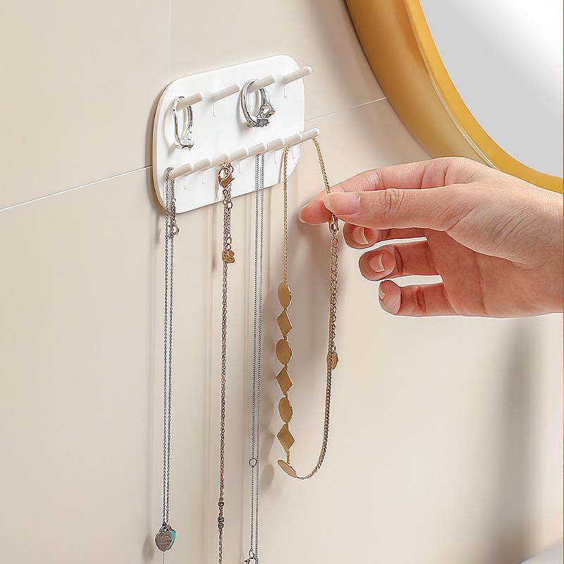 Wall-Mounted Punch-Free Jewelry Hooks: Ring, Earring, Necklace Holder for Home Use with No-Trace Adhesive.