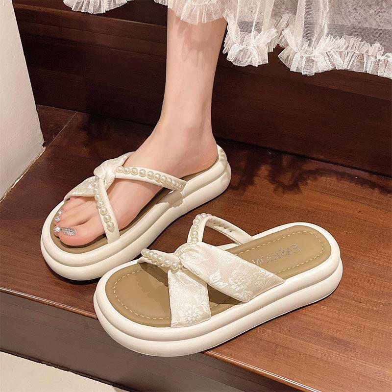 Thick bottom height increase outer wear one-word slippers female 2025 summer new fairy wind French beach pearl cool slippers