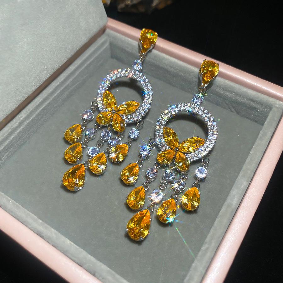 Silver Needle Diamond Inlaid Butterfly Tassel Earrings and Necklace Set: Elegant Hollow Design with Personality and Style.