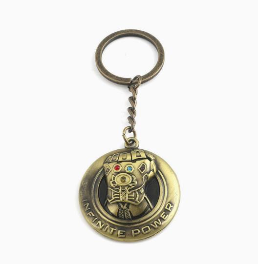 

Metal Keychain with Circular Pendant Featuring Detailed Glove Design and Textured Surface Suitable for Collectors and Everyday Use One Size
