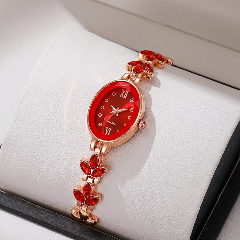 Luxury Rhinestone Women's Wristwatch with Round Dial and Colored Diamond Bracelet.