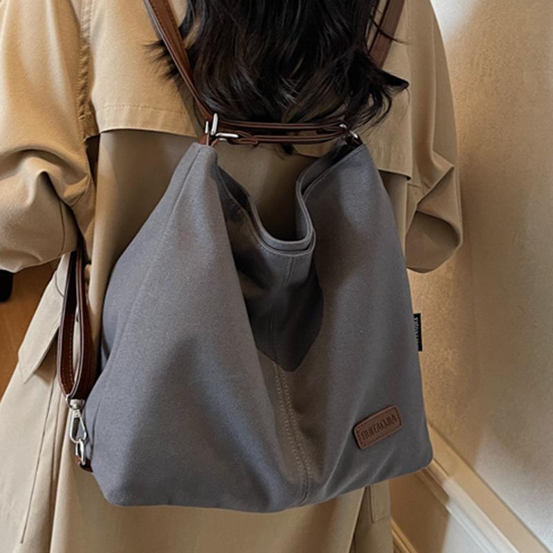 Sac femme nouveau grande capacité sac à dos de trajet sac bandoulière sac décontracté multi-port pour sortir
