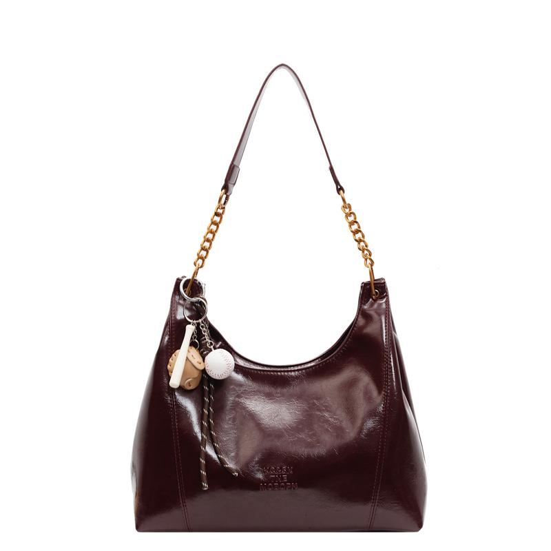 

Fashion commuter large-capacity bag women s new retro lazy style design tote bag design shoulder bag With pendant