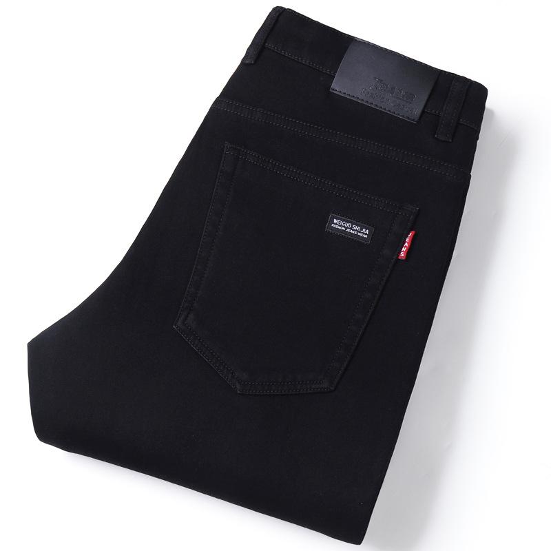 Klasické černé pánské džíny Tenká sekce trendu elastických slim rovných kalhot Business casual kalhoty