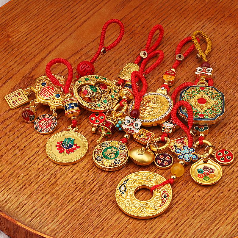 Zakiram Gold Sand Pendant: Attract Wealth, Ensure Peace & Happiness, Includes Fu Card, Perfect As Bag Accessory or Car Keychain.