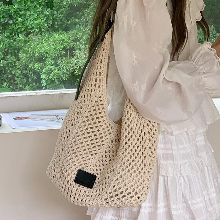 Woven hollow bag women's new seaside vacation style travel tote bag beach bag shoulder armpit bag tide
