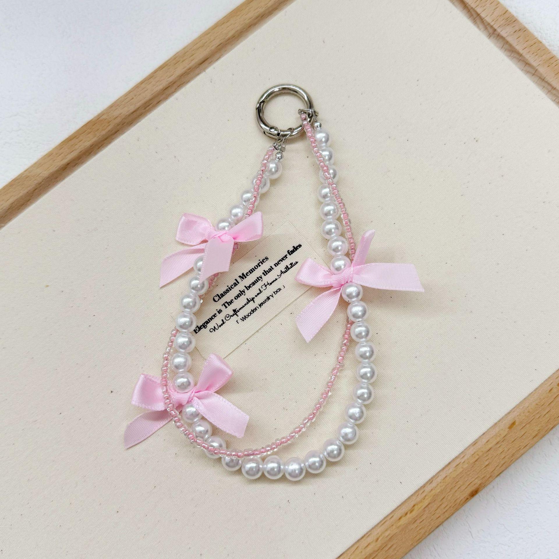 

Солодка перлова ланцюжок для мобільного телефону Балетний стиль Ланцюжок-бантик Універсальний кулон для мобільного телефону Рожевий кулон з намистинками Брелок рожевий