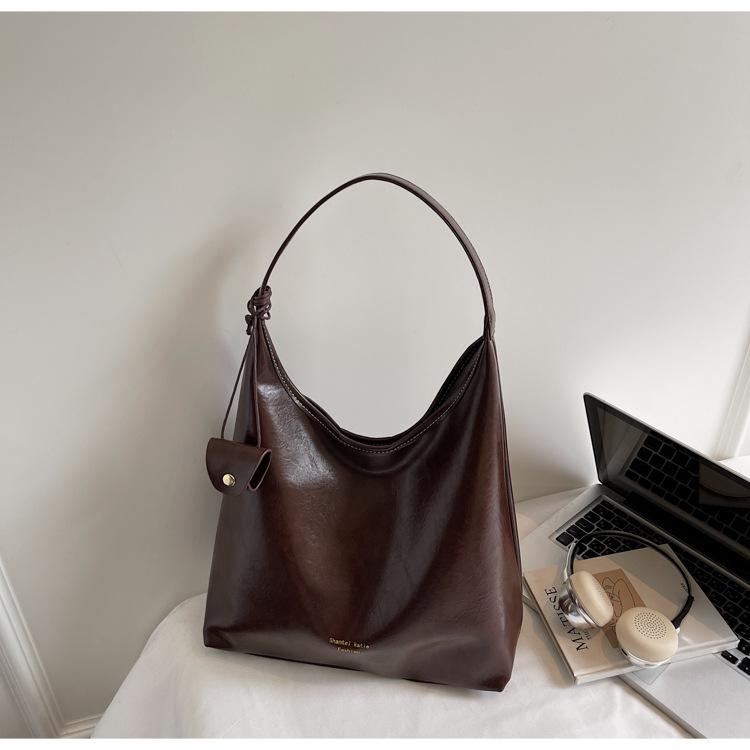 

Простая ретро большая сумка женская 2025 новая кожа с масляной восковой пропиткой большая вместимость сумка-тоут модная текстура сумка через плечо для通勤 темно-коричневого