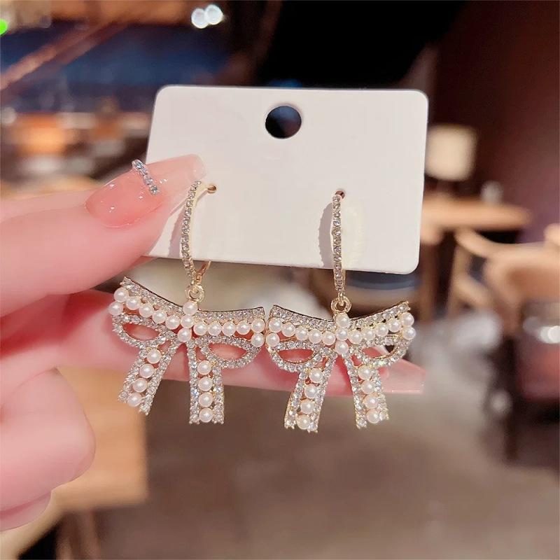Celebrity bow pearl fringed earrings women's light luxury high-end earrings fashionable exquisite versatile earrings