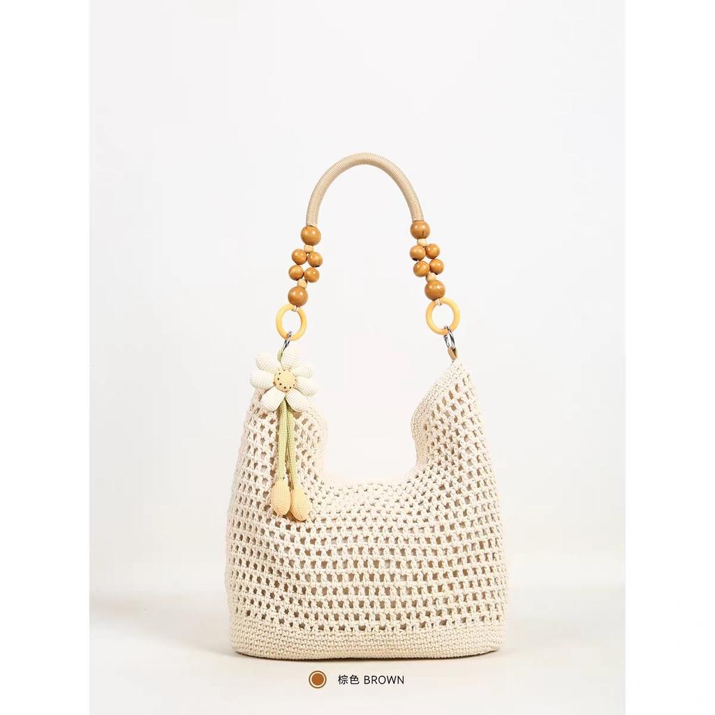Spring new seaside beach bag women's large-capacity hollow woven shoulder bag versatile portable tote bag