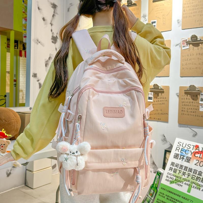 New schoolbag female junior high school college student small fresh bow large capacity backpack dopamine backpack