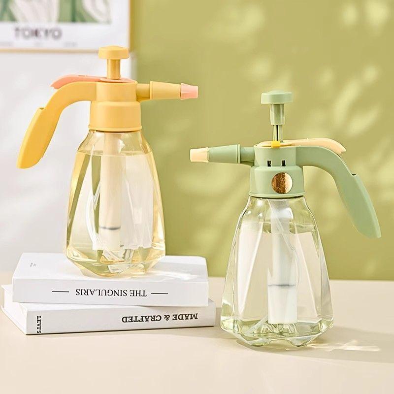 Household pressure spray bottle for watering plants, cleaning, and other uses; a small, air-pressure spray bottle for gardening.