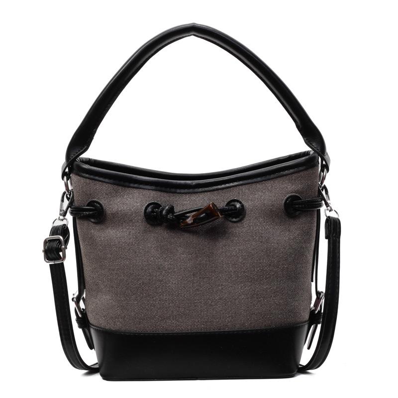 Niche design canvas splicing contrasting color bucket bag women's new portable commuter bag shoulder messenger bag