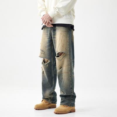 Calças Jeans Masculinas Personalizadas de Perna Larga Perna Reta Rasgadas Calças de Mendigo Cor Amarelo Vento Tingimento de Lama