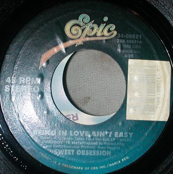 

7inch Record SWEET OBSESSION - Being In Love Ain t Easy / Somebody 3408521 Epic 1988 US Soul/Funk Used