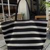 Premium black and white striped tote bag woven large capacity shoulder women's bag lazy wind lightweight vacation bag shopping bag
