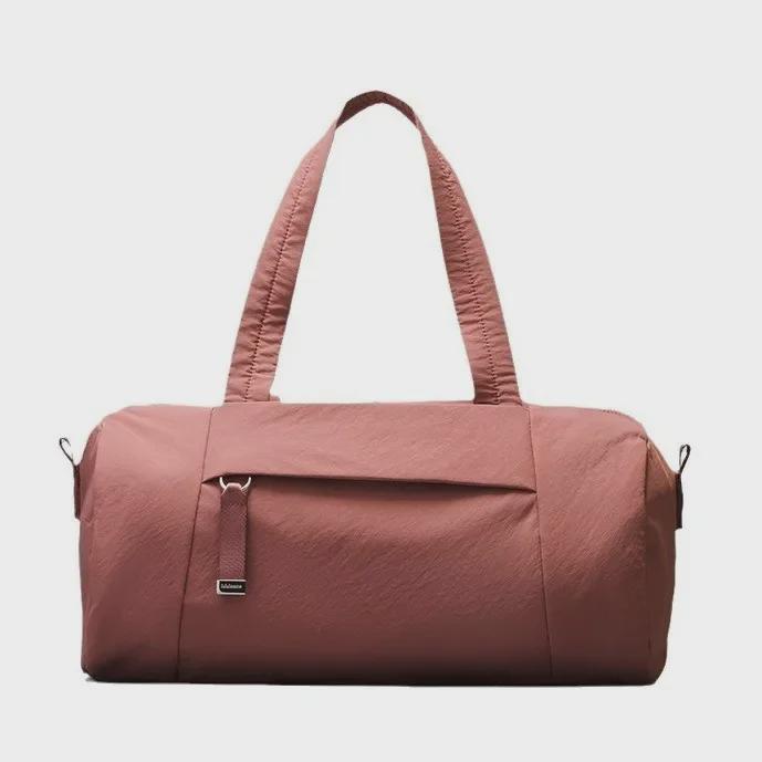 

Спортивный чемодан LULU 16 л 2024 года: Вместительная цилиндрическая сумка с застежкой-молнией, плечевыми ремнями и ремешком-мессенджером 16-inch дым/розовый