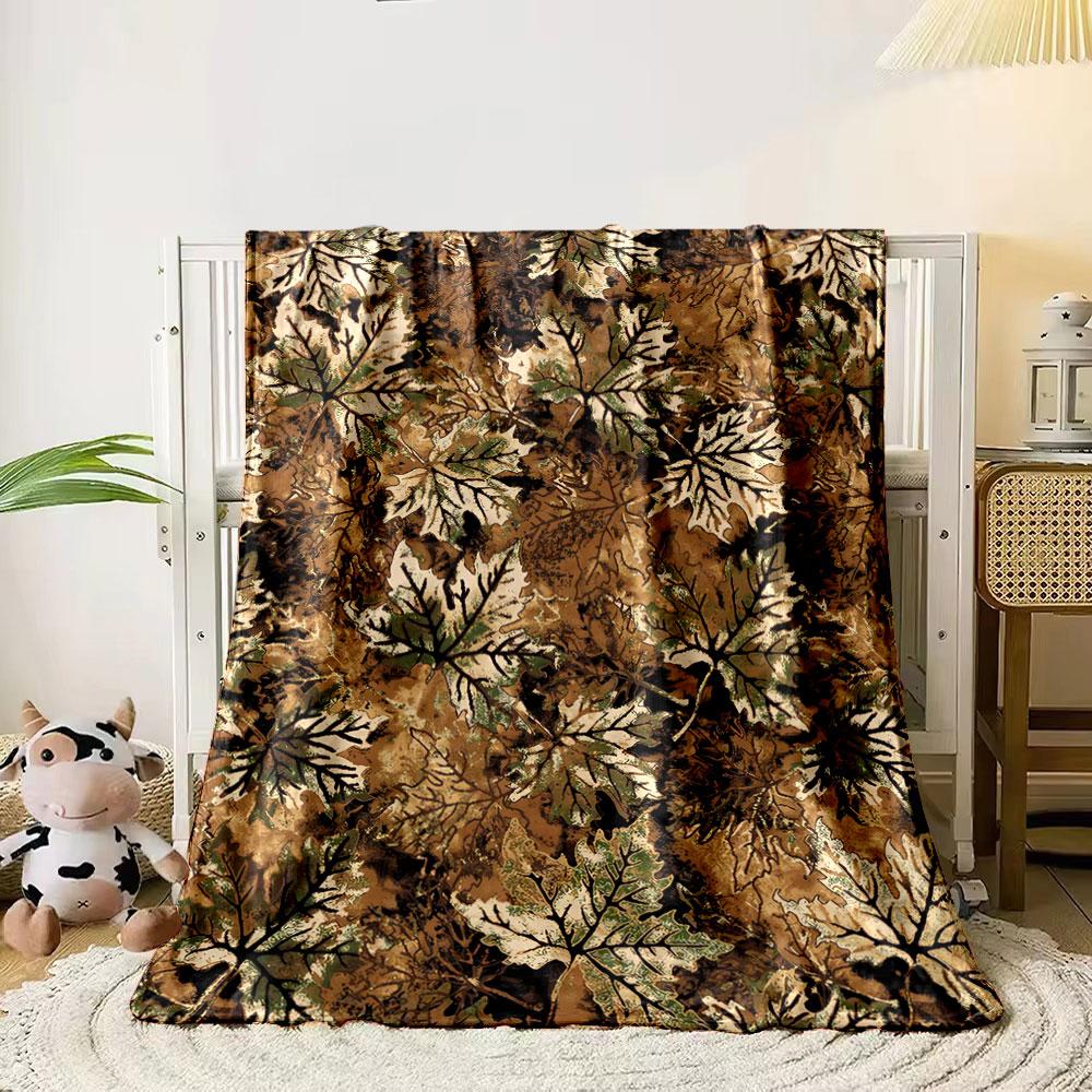 

The pattern features overlapping autumn leaves in brown, green, and beige. for all seasons blanket lunch break throw gift 80cm x 120cm