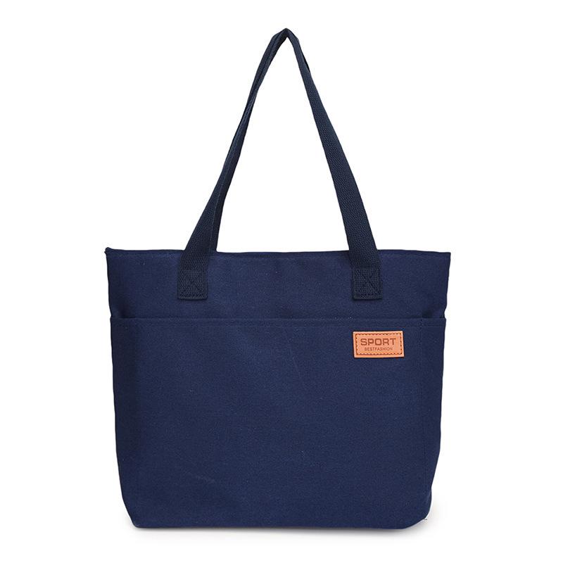 Women's Versatile Canvas Tote - Lightweight, Large Capacity, Single Shoulder or Handheld Bag for Students and Commuters.