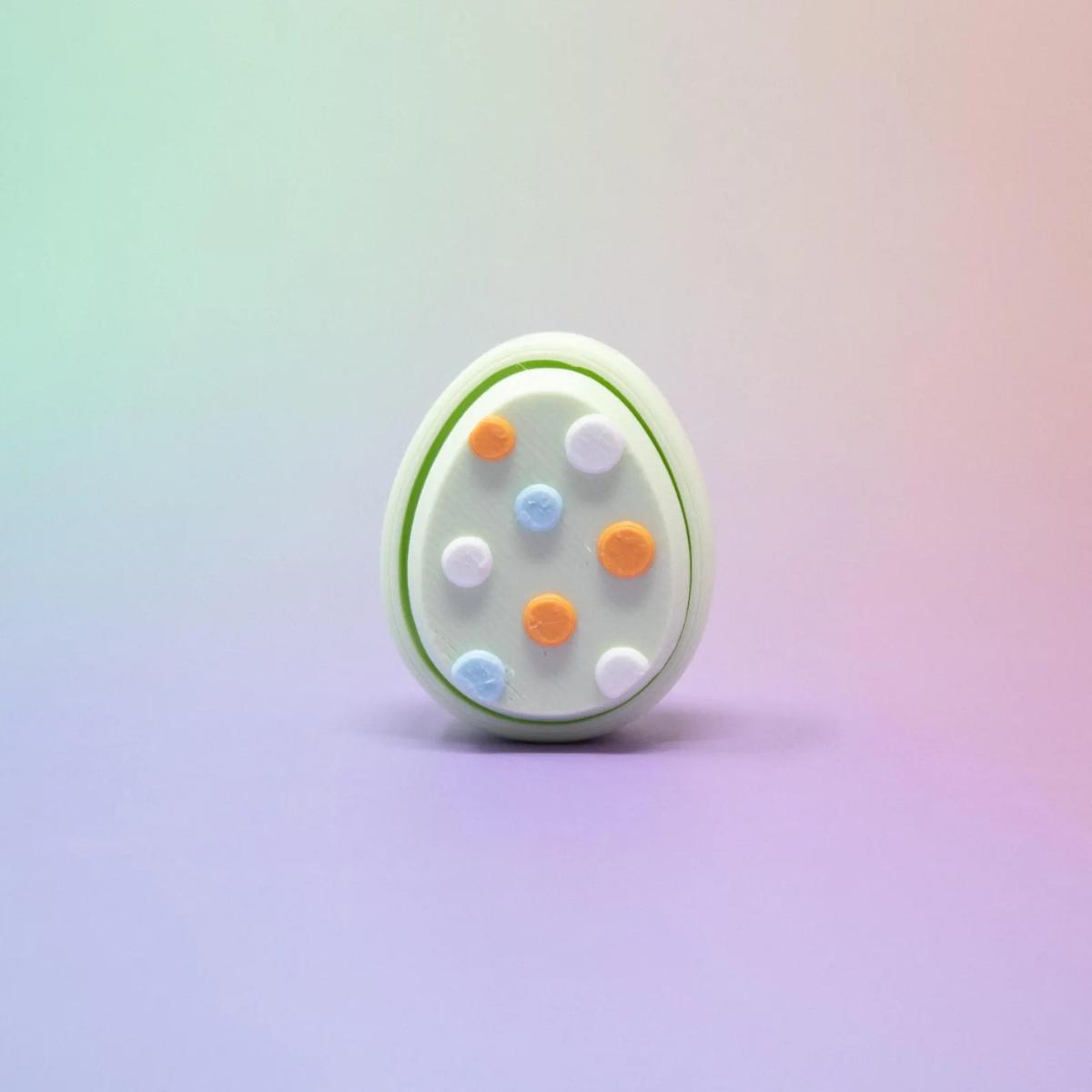 

Easter Egg Fidgeting Keychain, 3D Printed Small Clicker Toy, Pastel Colors, Egg-Shaped Fidget, Key Ring Attachment